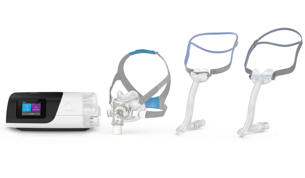 ResMed Airsense 11 CPAP machine and masks on a white background